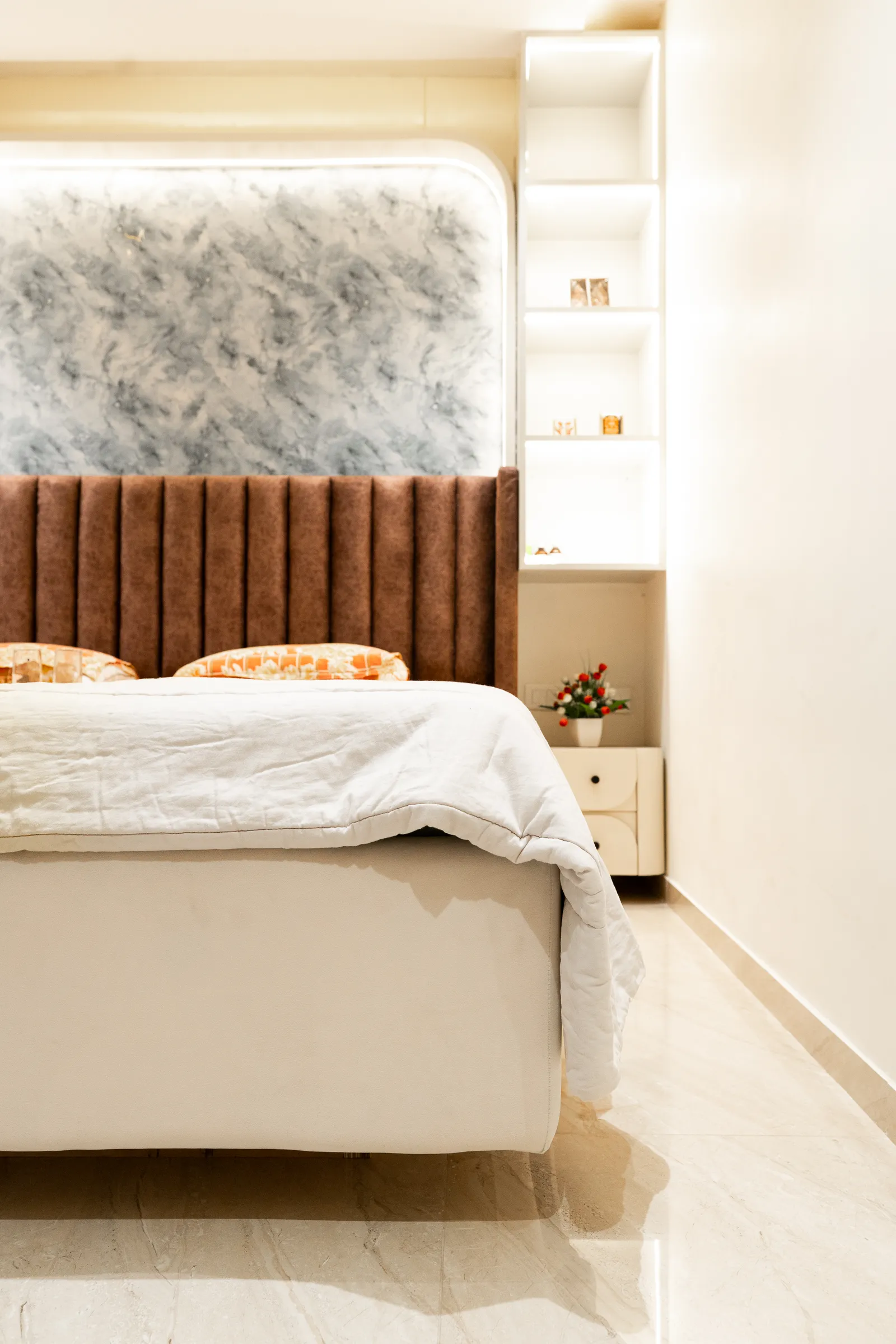 Bed with tufted headboard and lit wall niche — Arna's Home